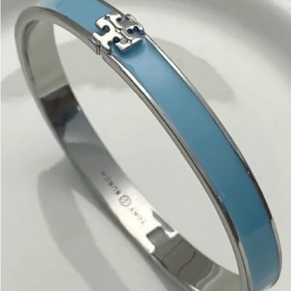 Authentic New with tag Tory Burch bracelet with pouch.